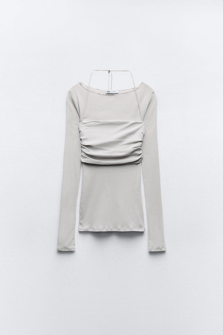 T-shirt semi-transparent court superposé manches longues