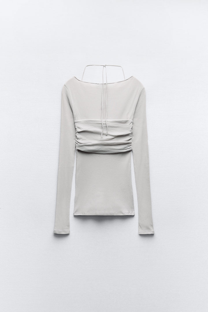 T-shirt semi-transparent court superposé manches longues
