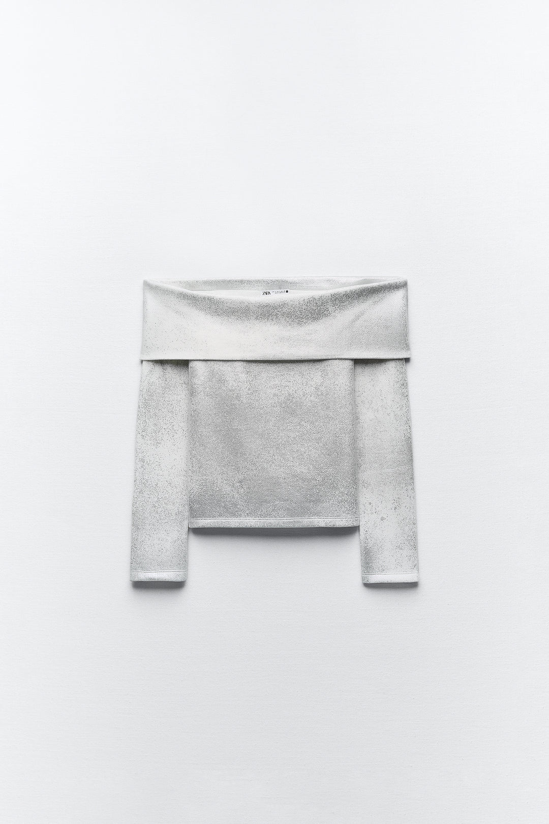 Pull épaules dénudées métallisé manches longues