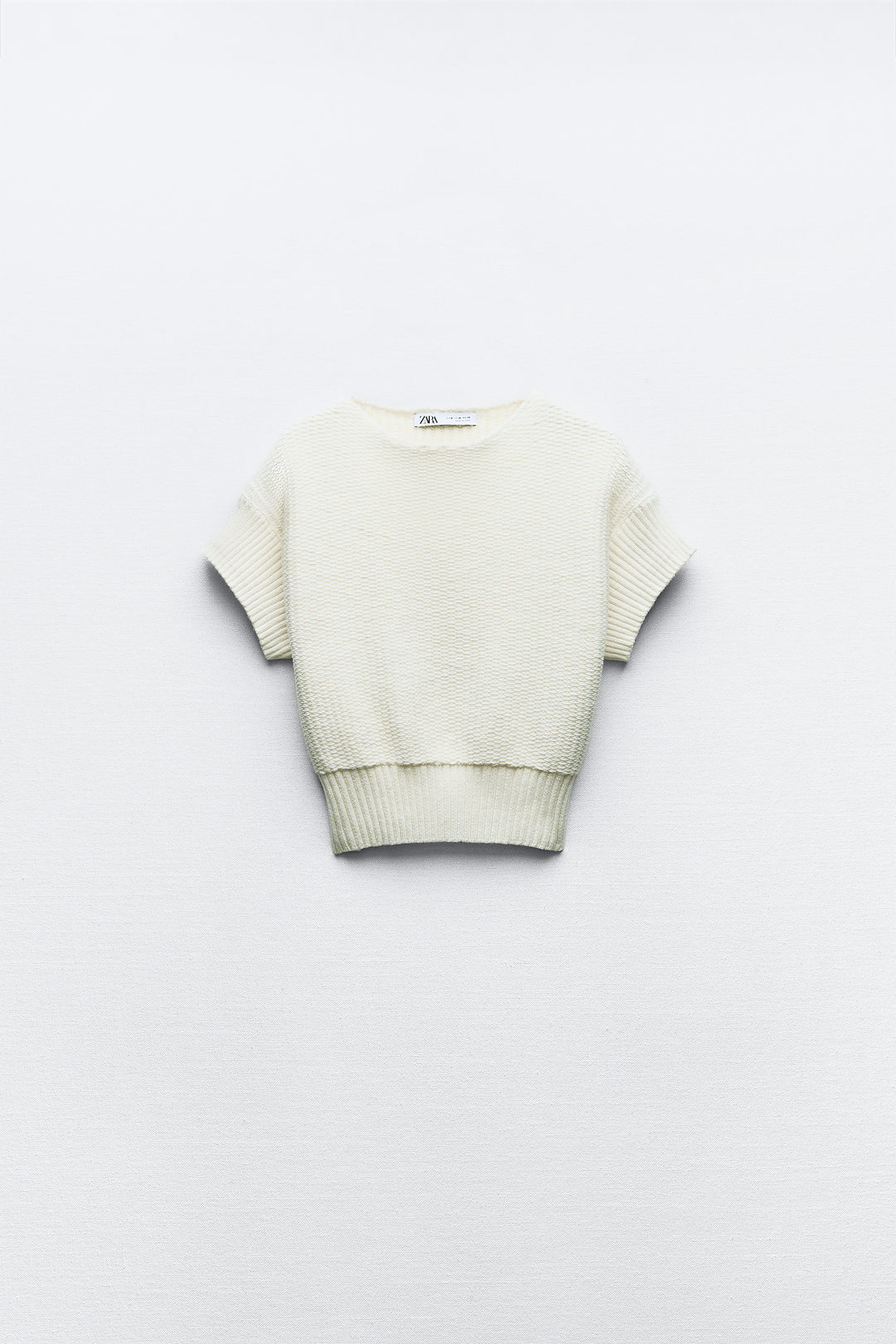 Top en tricot entrelacé cropped manches courtes