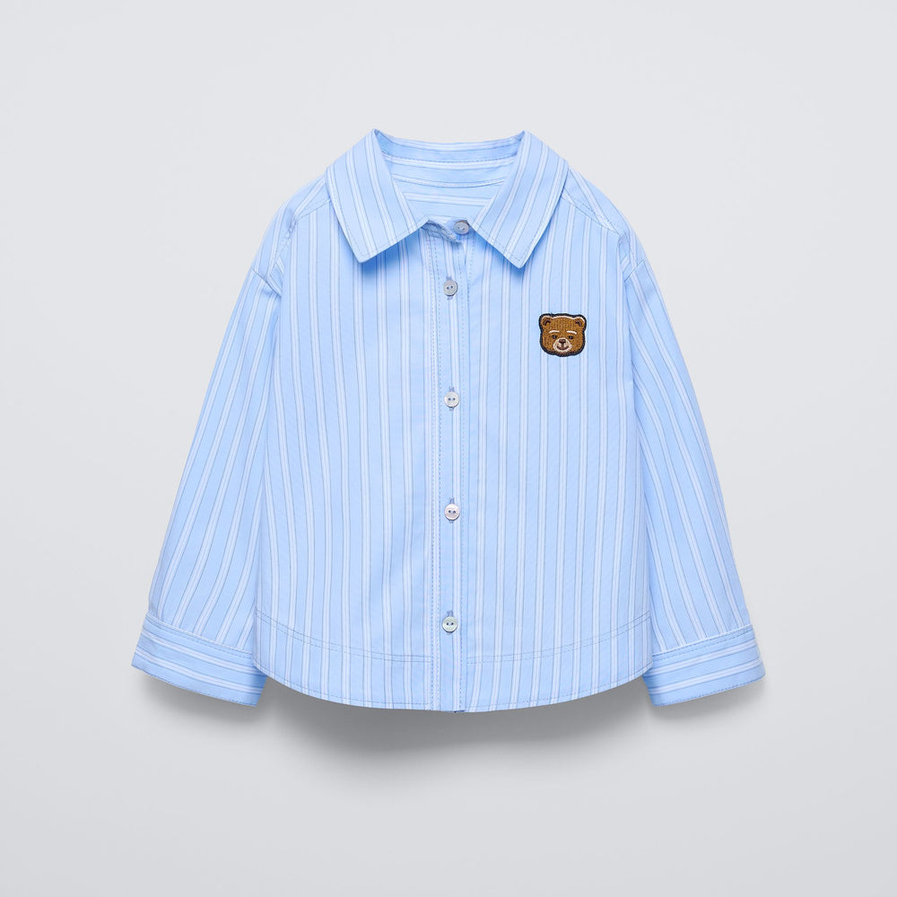 Moudda ZARA - Chemise rayée bleue patch ours - Tunisie 2